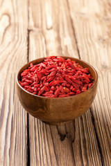 Wooden bowl with  goji berries