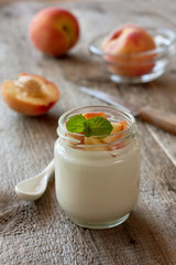 Yogurt with peach in a glass jar