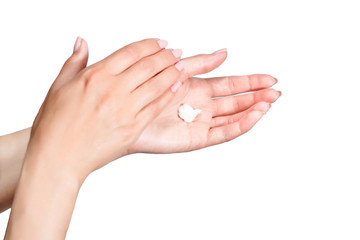 Female beautiful delicate manicured hands with moisturizing cream isolated on white background