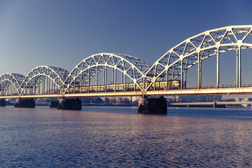 Fototapeta na wymiar A view of the Railway Bridge over Daugava River in Riga, Latvia