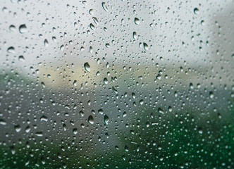 Selective focus, Raindrops on glass with city (raindrops,blur, rain)