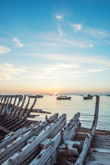 Obraz premium abandoned fishing boat at seaside -Yantai,China