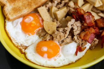 Breakfast. Fried eggs and pork chops close up