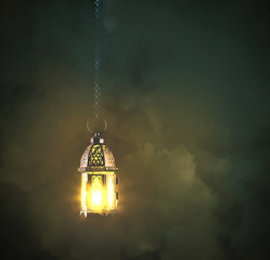 Fototapeta na wymiar lantern lamp hanging on metal chains