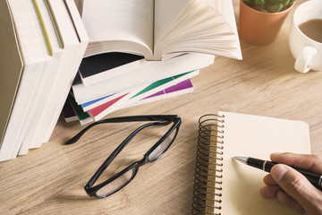 Stack of books on wooden table, Education background