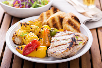 Grilled pork chops with vegetables and bread