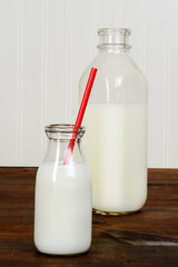 closeup glass of milk with red straw