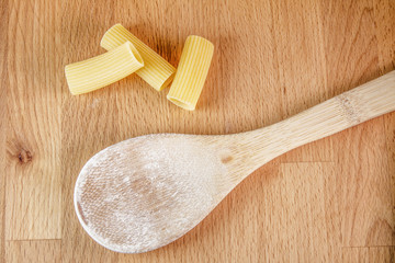 raw dried pasta on cutting board