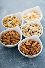 Variety of nuts in small bowls