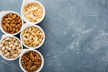 Variety of nuts in small bowls