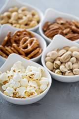 Variety of healthy snacks in white bowls