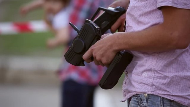 The man using the remote control controls radio-controlled drift car
