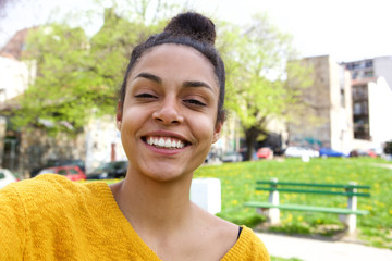 Cheerful african woman taking selfie