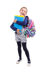 Preschool student girl carrying notebooks and backpack on white