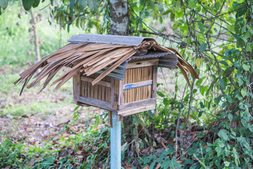 Wooden bee house in the garden