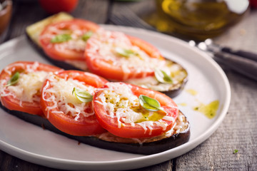 Grilled zucchini with tomatoes and cheese