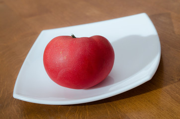 ripe tomato with drops of water