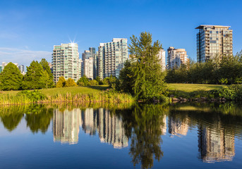 Fototapeta na wymiar Residental Buildings viewed from the lake at a public park.