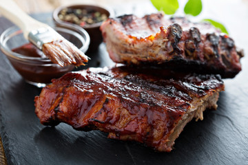 Grilled pork baby ribs with bbq sauce - obrazy, fototapety, plakaty