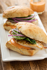 Grilled chicken sandwich with red pepper sauce