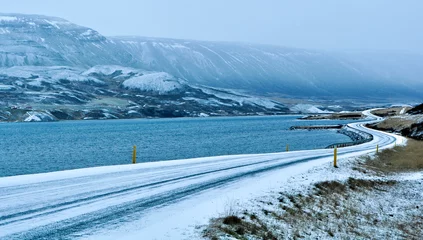 Washable wall murals Scandinavia frozen winding road the ocean shores in Iceland  