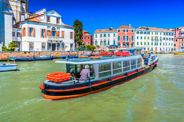 City life in Venice Italy. / Urban life and water bus transportation in Venice Italy.