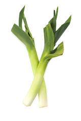 Green leeks on a grey wooden table