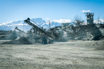 stone crusher at work, the extraction of gravel, the mining and production of crushed stone