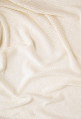 Fabric textures - a full frame close up of cream woven cloth material, for use as a page background