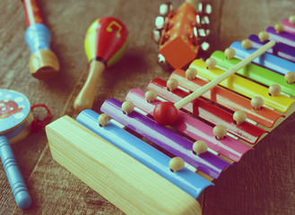 Musical instruments on wooden background