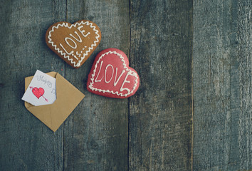 Obraz na płótnie Canvas Beautiful heart cookie for valentine day on wooden desk