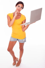 Smiling young brunette with a laptop