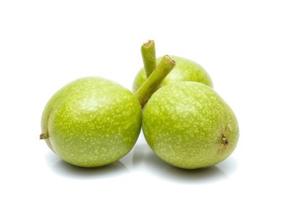 green walnuts isolated on white background