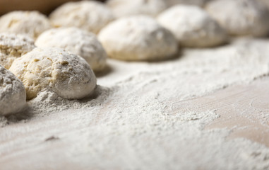 Fototapeta na wymiar Buns of Dough Covered in Flour