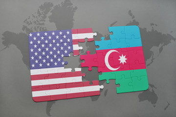 puzzle with the national flag of united states of america and azerbaijan on a world map background