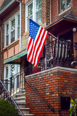 United States flag on an old vintage porch