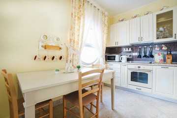 Interior of a guest house room with kitchen