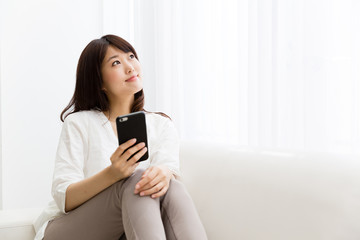 attractive asian woman using smart phone