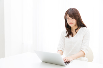 attractive asian woman using laptop computer