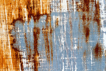 A background of peeling paint and rusty old metal