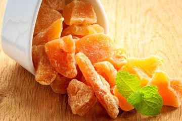 Closeup candied dried ginger in white bowl