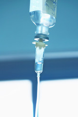 Naklejka na ściany i meble Medical drip on blurred background of hospital room