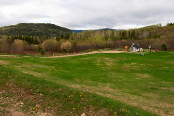 Meadow with tiny church