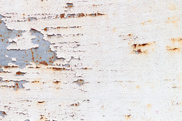 A background of peeling paint and rusty old metal