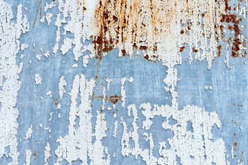 A background of peeling paint and rusty old metal