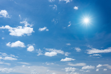 Naklejka na ściany i meble Sun with sunlight in cloud on blue sky background