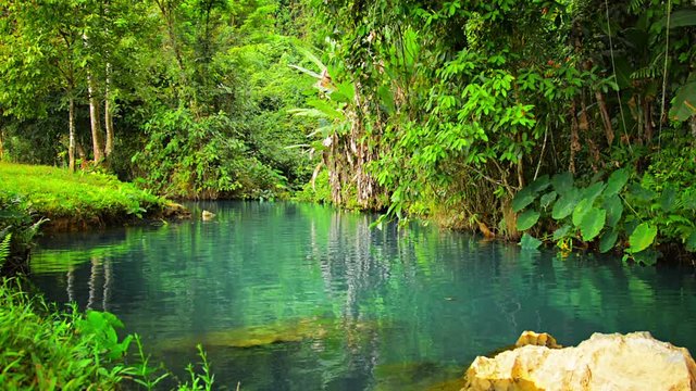 1920x1080 video - Beautiful natural greenery and crystal clear, blue, rippling water of Blue Lagoon in Vang Vieng, Laos.
