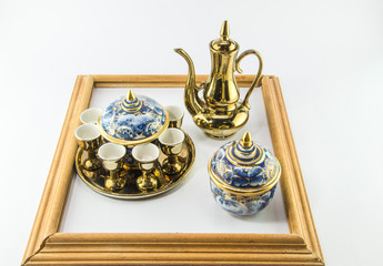Fototapeta na wymiar Gold jug Tea glass benjarong in frame on white background