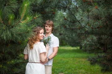 Portrait of a happy loving couple outdoor in the green park