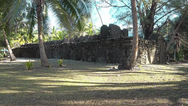 Ancient stone structure marae (sacred place) Manunu on the motu Maeva, Huahine island, French Polynesia

